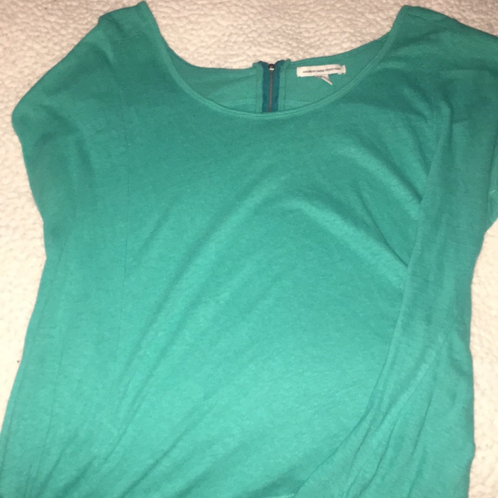 American Eagle zipped back blue tee.